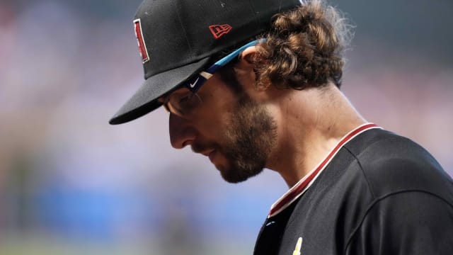 Arizona Diamondbacks right-hander Zac Gallen looks down to the mound during the third inning in a game against the Baltimore Orioles at Chase Field.